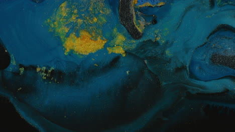 explosión de líquido azul y puntos amarillos abstractos