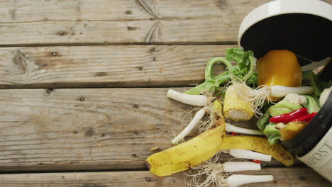 video of white compost bin with organic waste and copy space on grey wooden background