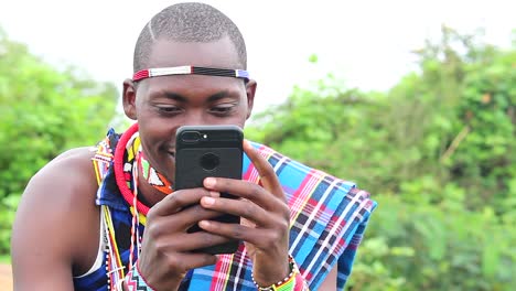 maasai man enjoying using his cellphone