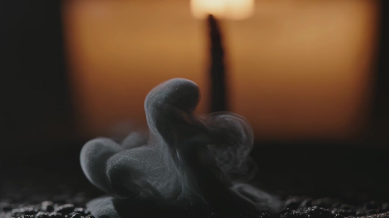Releasing center sending gray plume rising unfolding dispersing on granular tray with backlight