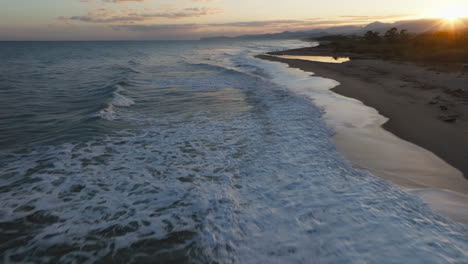 ocean waves at sunset over the mountain in natural italian mediterranean sea