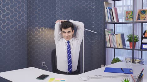 Young-businessman-exercising-in-the-office.