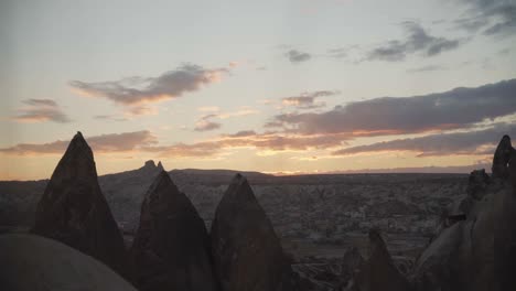 Coned-Shaped-Rock-Formations-On-Dramatic-Sunset-Sky-In-Cappadocia,-Central-Turkey