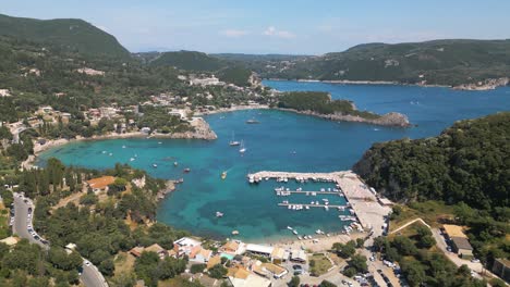 paleokastritsa bay in corfu, greece - backwards drone shot