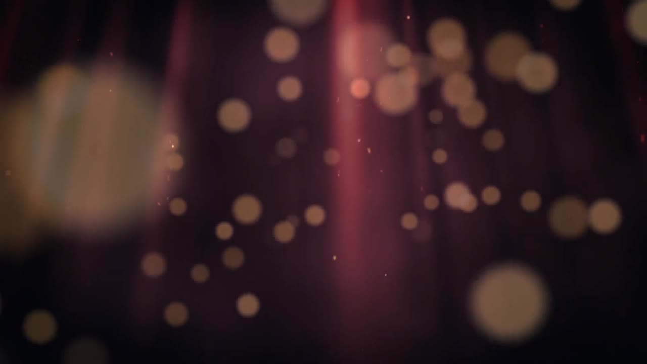 Digitálně generované video zářících bodů pohybujících se na černém pozadí.