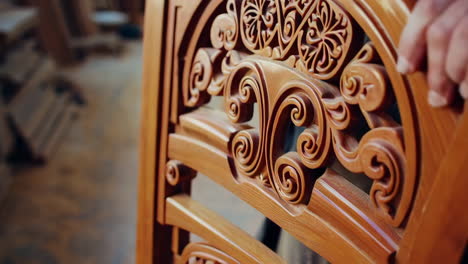 wood carving craftsman and detail of carved chair back