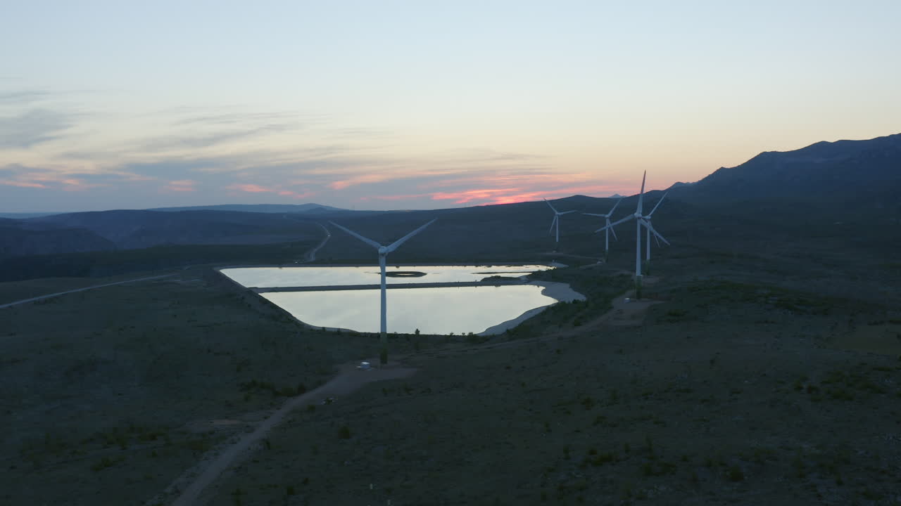 Wind Farm at Sunset in Mountainous Landscape