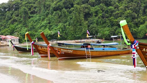 longtail boats on a tropical beach