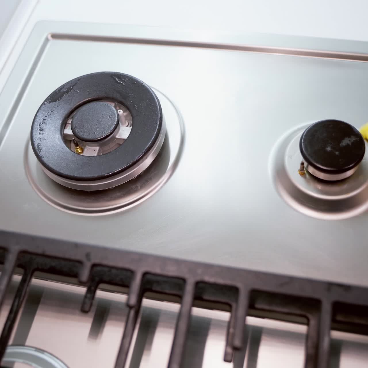 Woman cleaning gas stove