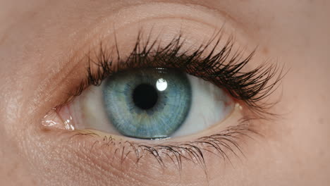 close up beautiful blue eye opening human iris macro natural beauty