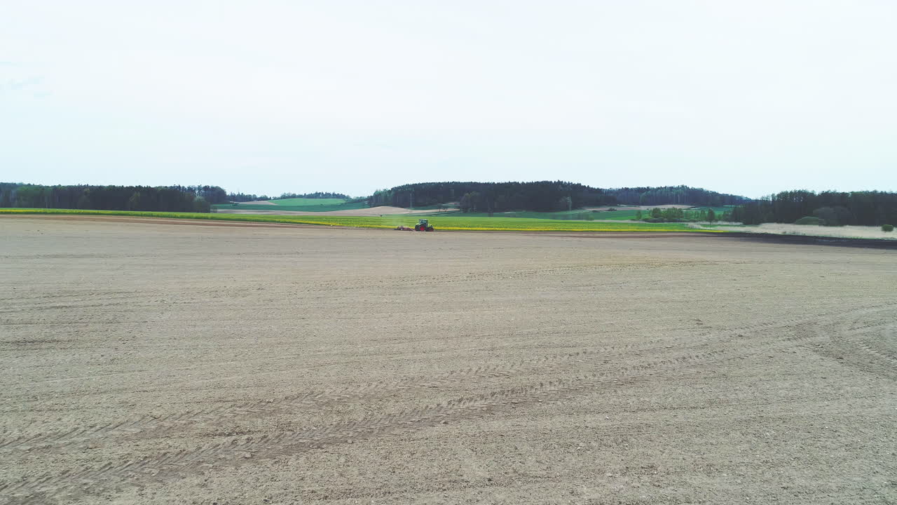 Tractor Plowing Field for Vegetable Farming