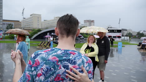 couple dancing in the rain