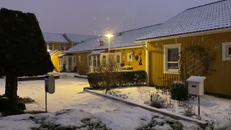 snowing in swedish winter suburbs