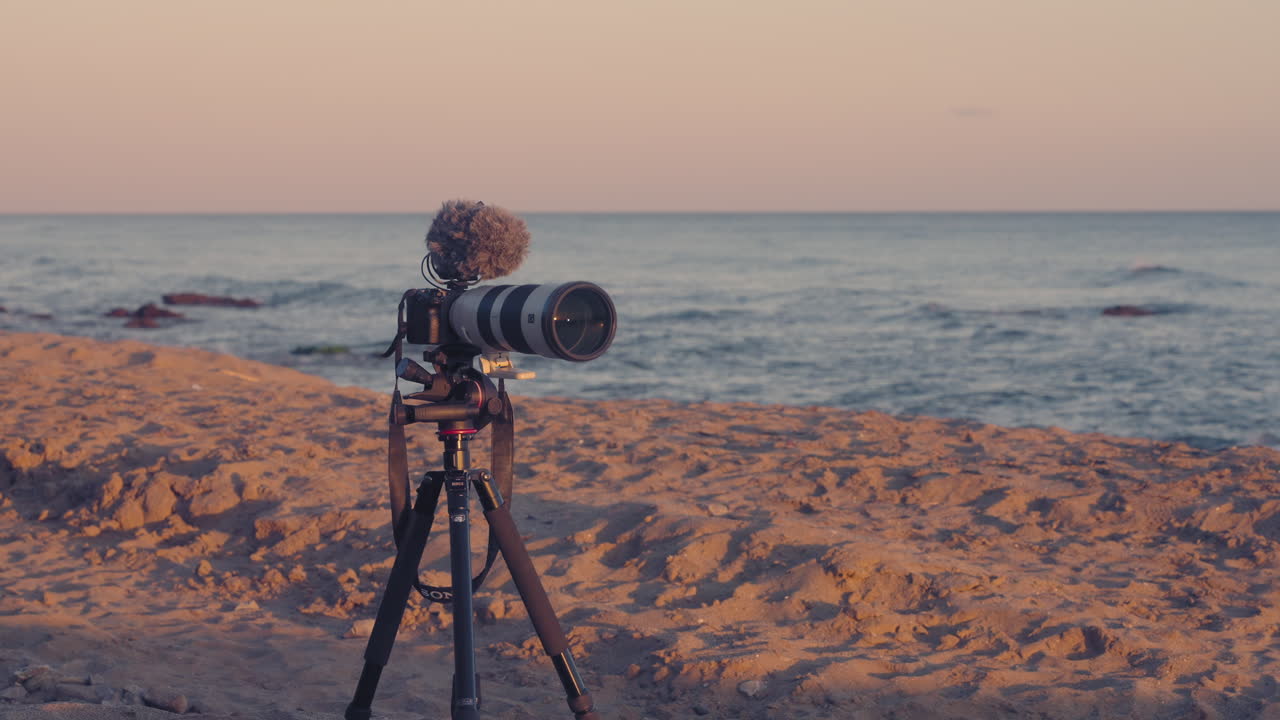 Camera and tripod at the beach