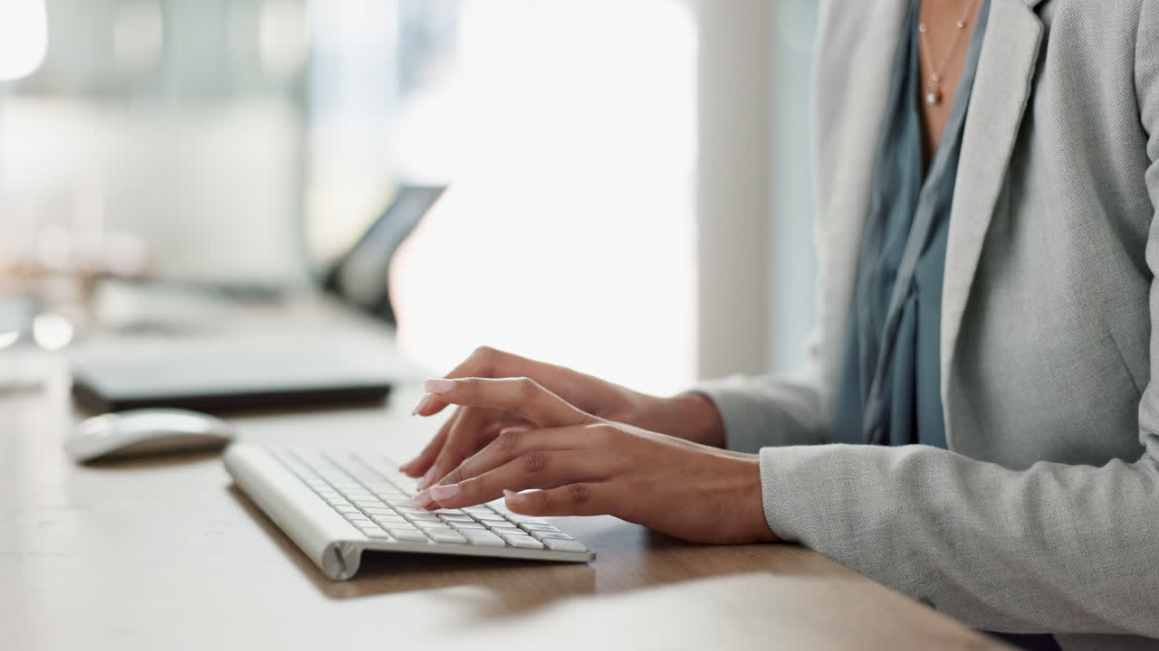 Premium stock video - Keyboard, hands and business person in the office