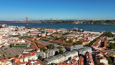 aerial view of lisbon cityscape with 25 de abril bridge and tagus river