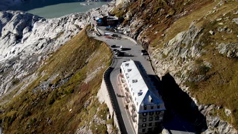 aerial flyover over furka mountain pass at the border of valais and uri in switzerland, a popular road trip destination thanks to its alpine views