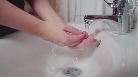 a female washing her hands in slowmotion-1