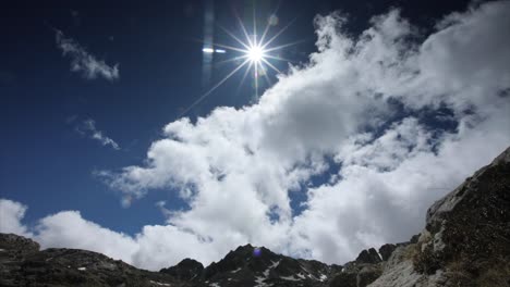 mountain landscape with clouds and sun