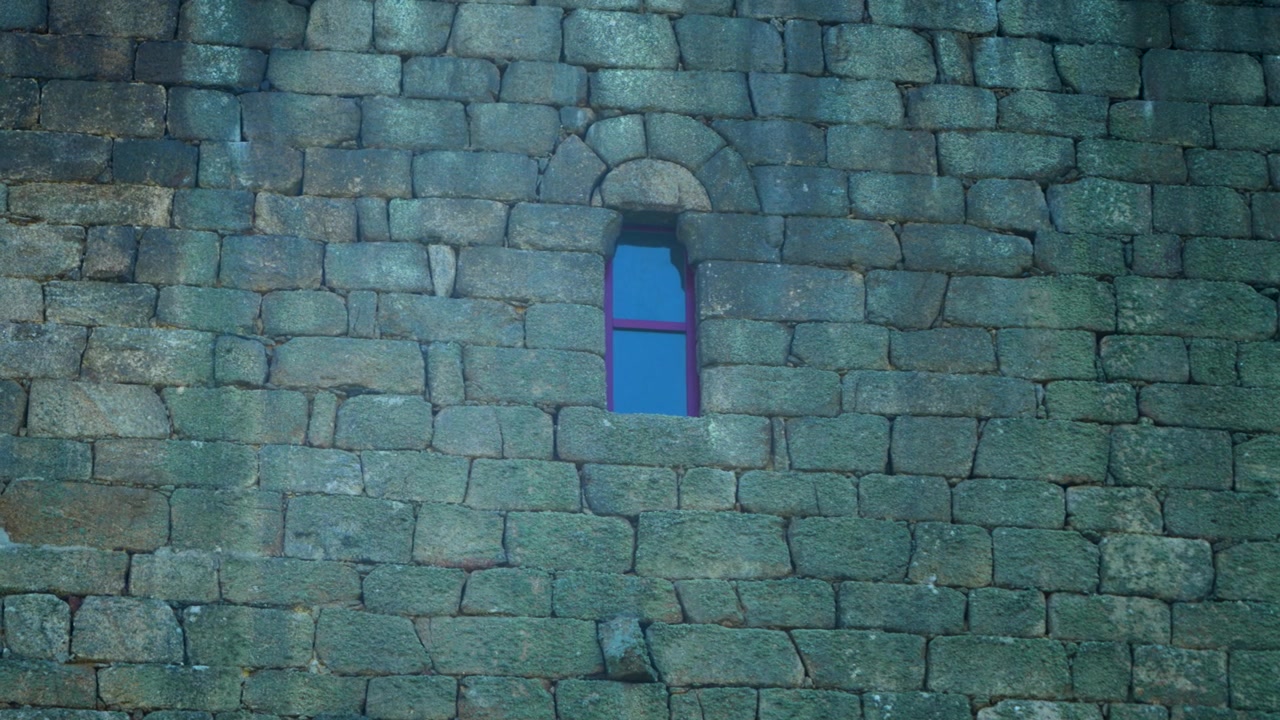 Stone wall and narrow window detail Tower of A Forxa in Porqueira, Ourense, Galicia, Spain