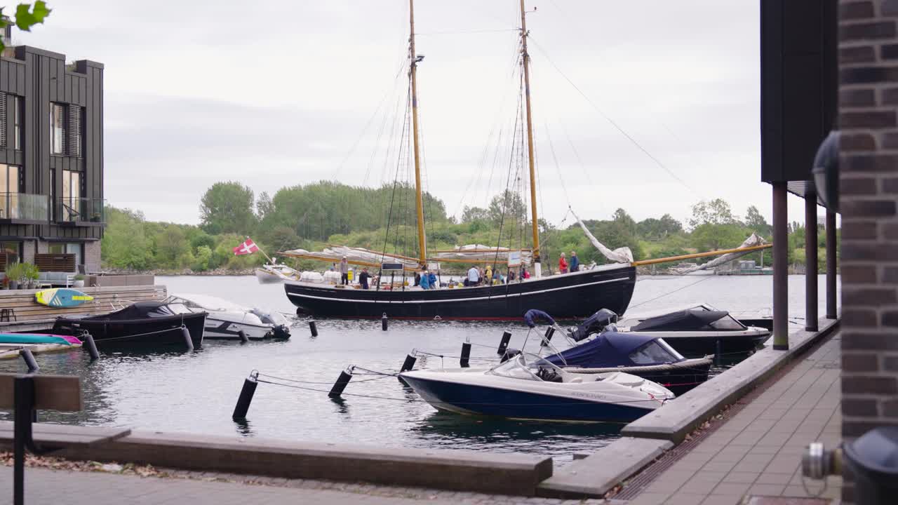 Renovated sailing boat float on city canal near Sanders pier, Copenhagen