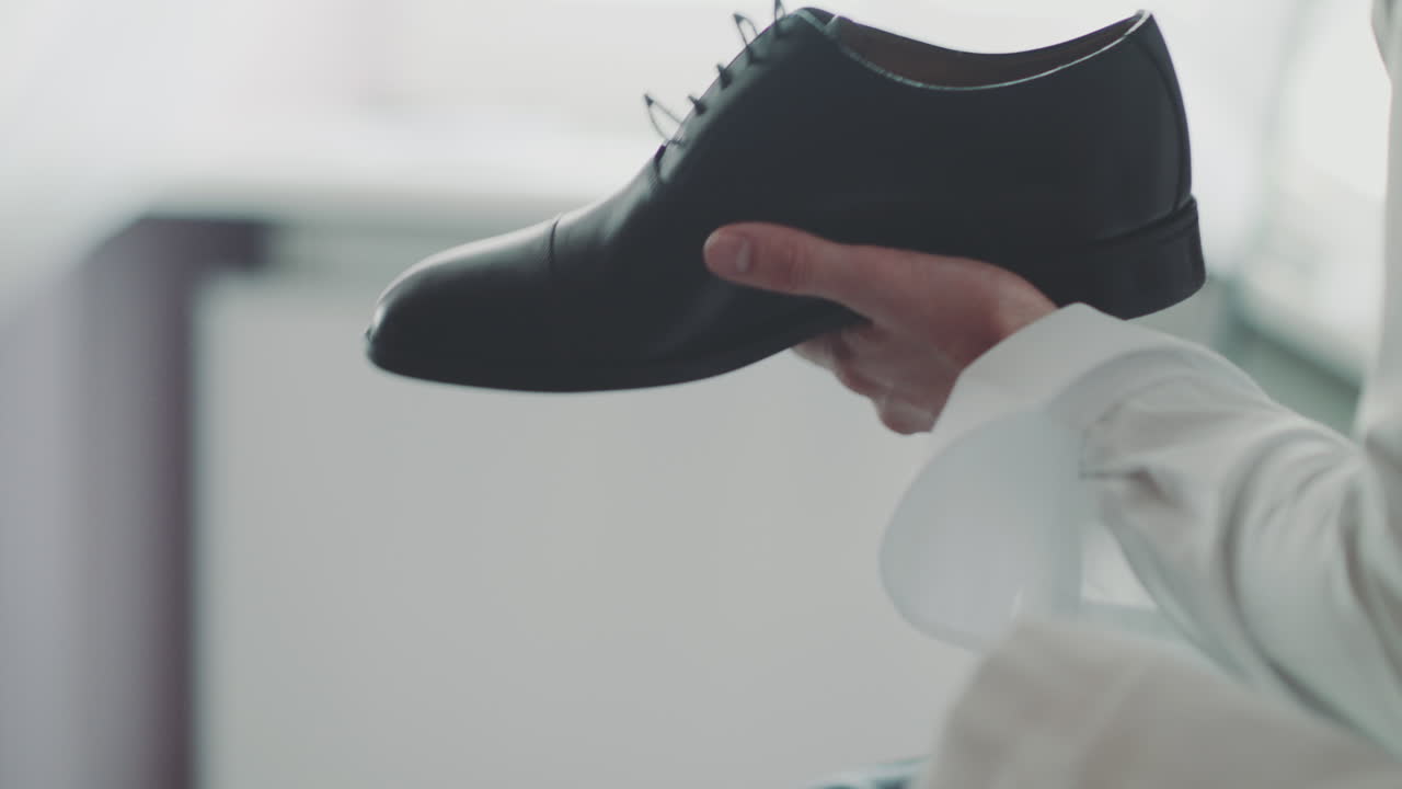 Man Unlaces Shoe Close-Up