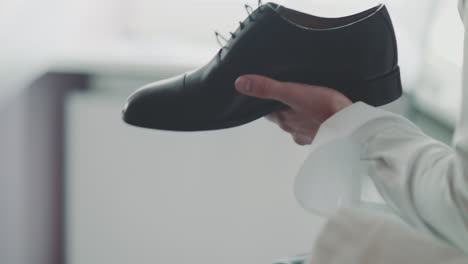 man unlaces shoe close-up
