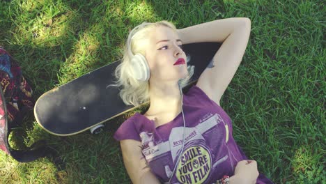 young blond woman relaxing listening to music