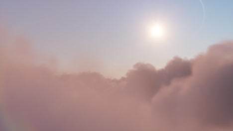 flight through moving cloudscape with beautiful sun rays