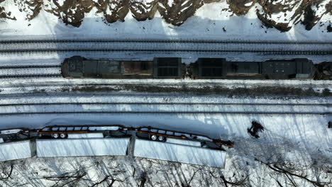 diesel engine locomotive train car passes derailed accident on railroad tracks