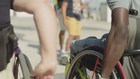 african american man with disability walking with friend