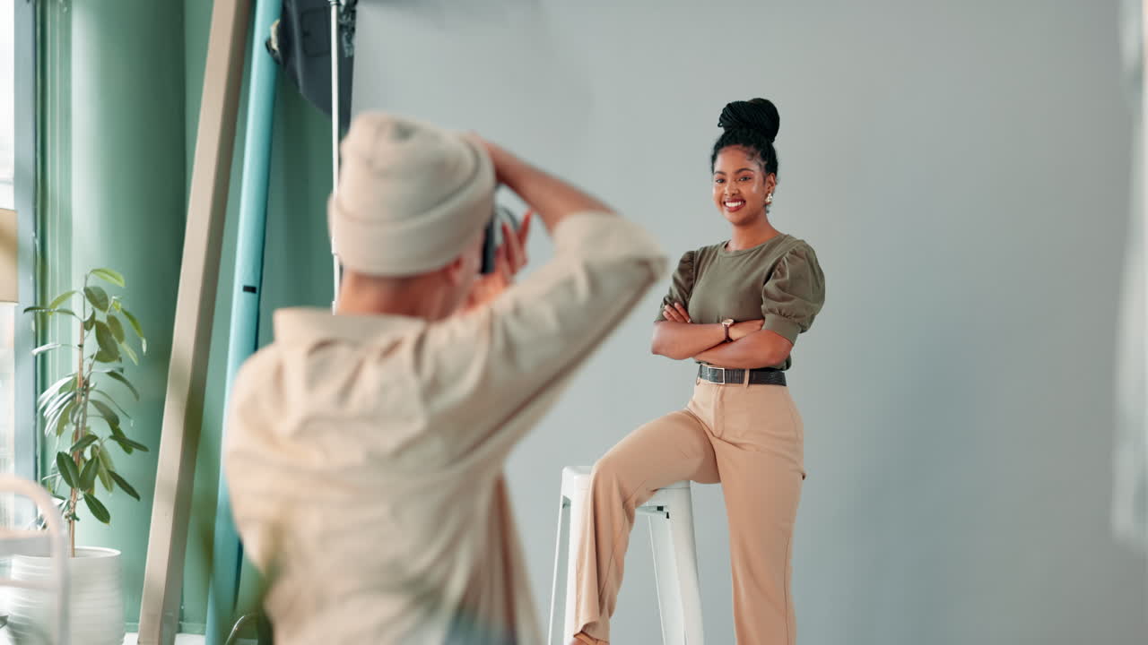 A woman posing for a photoshoot in a studio