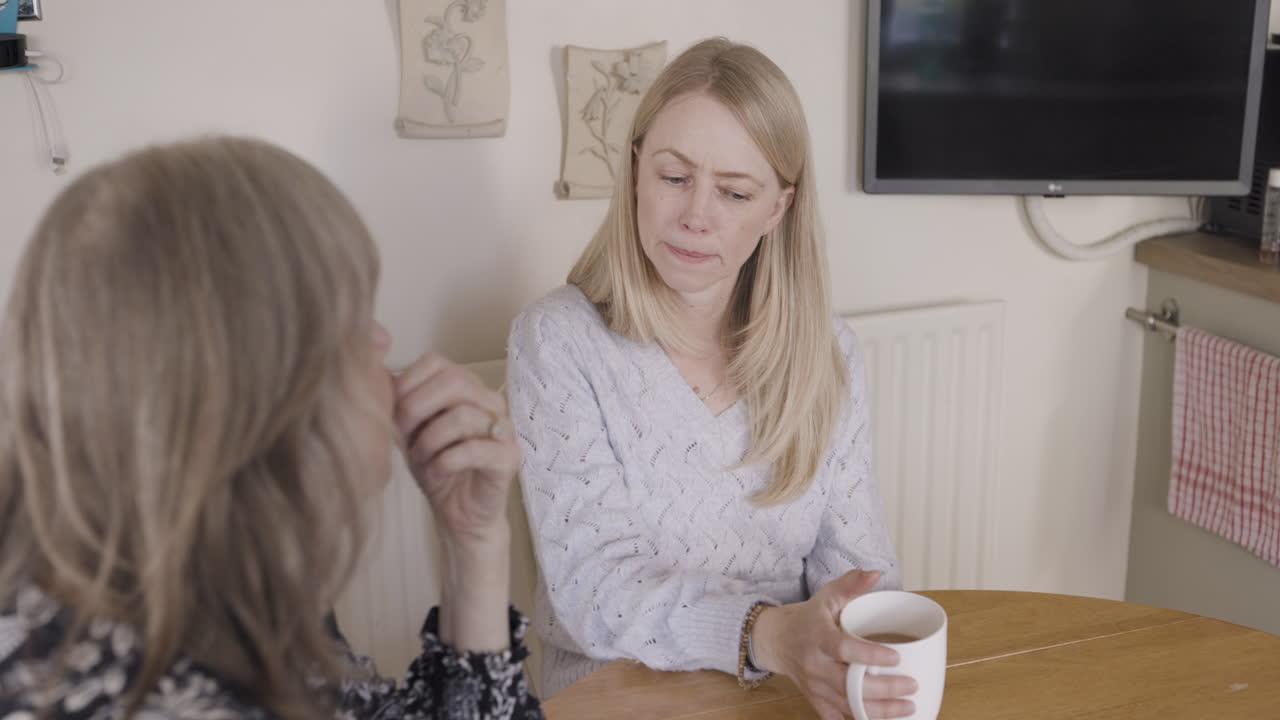 Two women having a conversation at a table