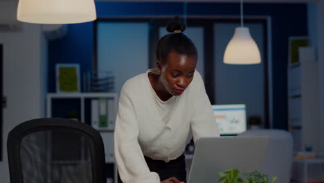 focused tired business woman looking at camera after reading mails on laptop