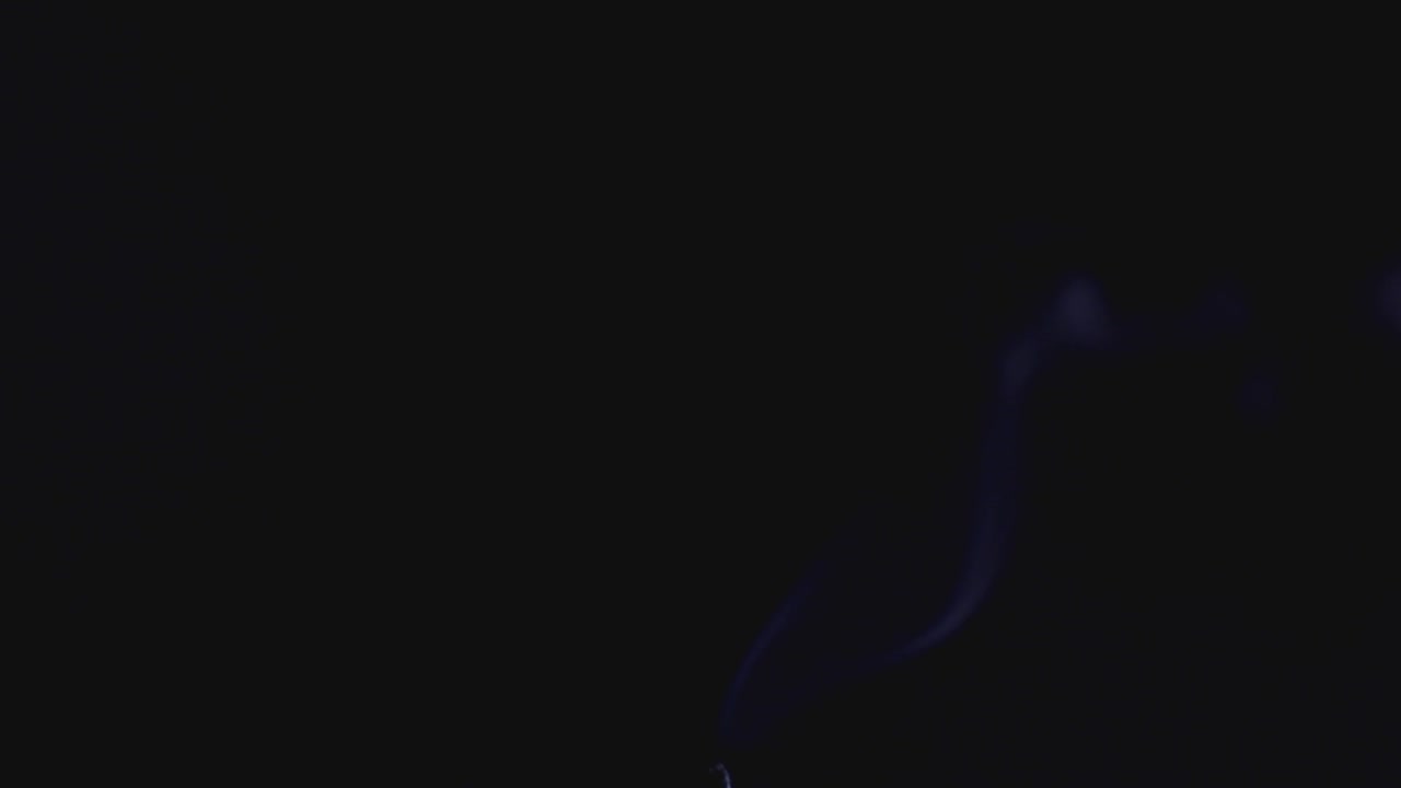 Extinguished Candlelight With White Smoke Isolated On Black Background. - close up shot