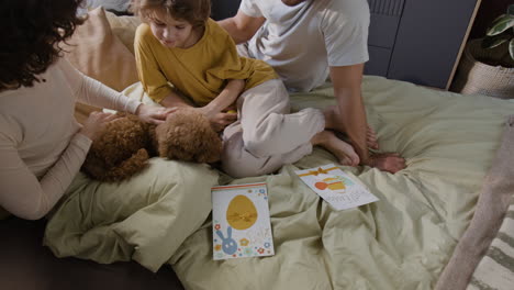 family celebrating easter in bed