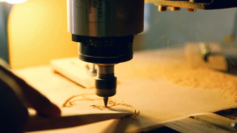 wood cut machine moves above working table. industrial wood cut machine moves above working table and drills