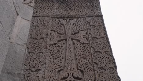 Tilt-up-huge,-intricately-carved-stone-khachkar,-Armenian-cross-stele