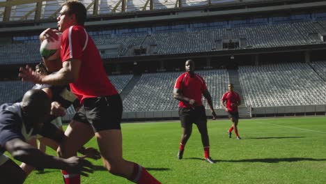 Rugby-players-playing-rugby-match-in-stadium-4k