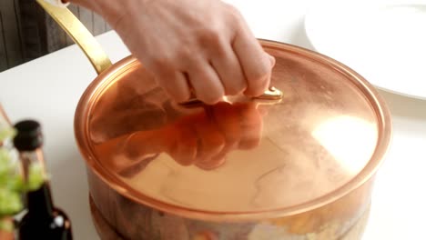 unrecognizable cook preparing risotto in pan