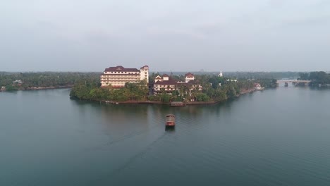 drone footage of lake with a hotel in the centre of the lake