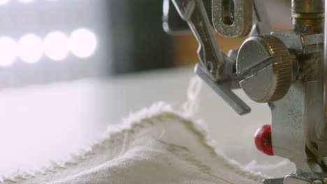 TILT-DOWN-CLOSE-UP-a-sewing-machine-in-action