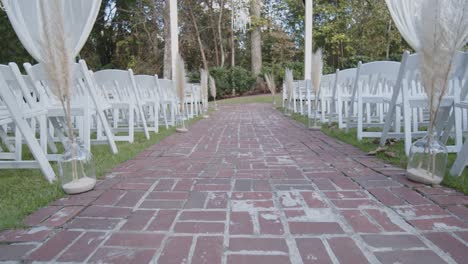 elegant brick paved wedding ceremony aisle