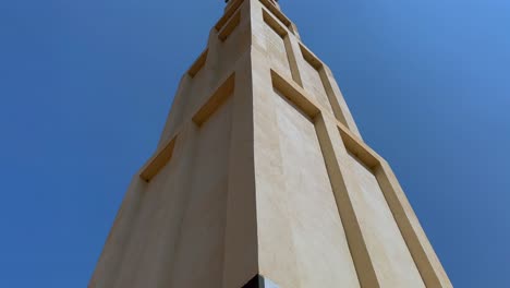 tilt up close up view of national war memorial tower in lilongwe, malawi.