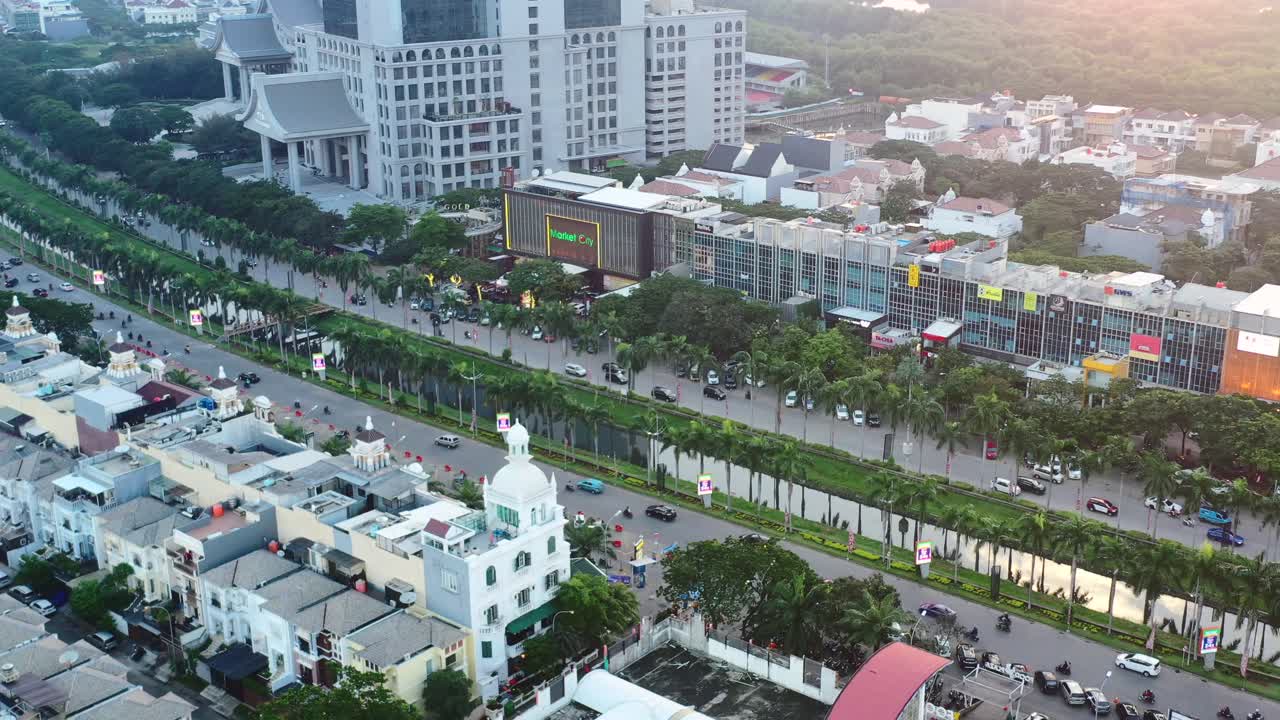 aerial top down view of traffic at sunset driving through PIK in Jakarta Indonesia