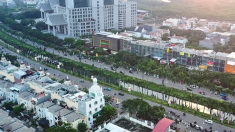aerial top down view of traffic at sunset driving through pik in jakarta indonesia