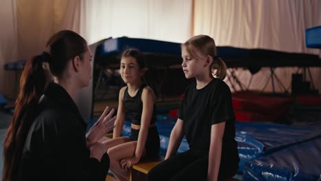 young gymnasts training with their coach