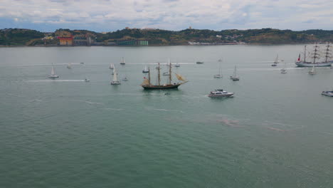 drone view ships sailing at cloudy ocean landscape. many yachts floating sea