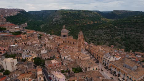 aerial above the steep streets of ragusa ibla, capturing the charm of its ancient layout. sicily, italy