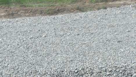 excavator carries gravel in the bucket
